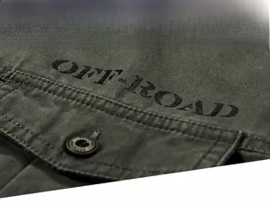 Macro shot of cotton twill fabric texture and OFF-ROAD print on army green cargo shirt