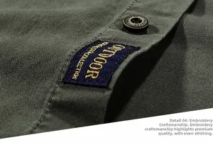 Detail of army green cotton shirt showing outdoor embroidery and stitching quality