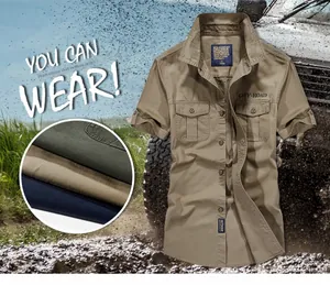 Detail of khaki cotton utility shirt featuring dual chest pockets and off-road embroidery