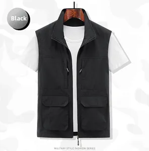 Detailed view of black multi-pocket outdoor fishing vest with metallic zippers