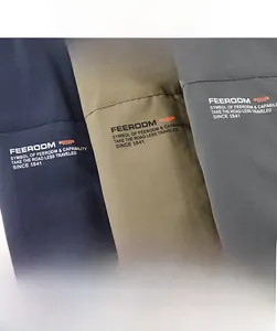 Close-up of durable, breathable mesh fabric in navy, khaki, and grey for outdoor vests