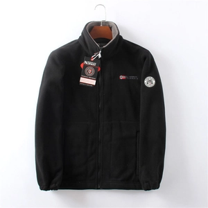 Close-up of black fleece jacket collar with zipper and Norway flag embroidery detail