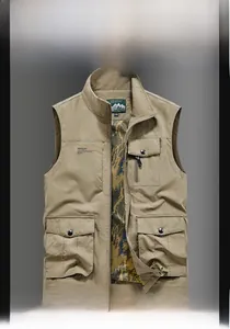Detail view of khaki outdoor vest featuring mesh lining and large cargo pockets