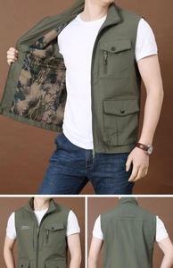 Detail view of olive green outdoor vest showing camouflage mesh lining and multiple pockets