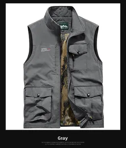 Detailed close-up of gray outdoor vest showing breathable mesh lining and cargo pockets