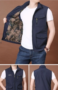 Detail of navy blue multi-pocket tactical vest with camouflage mesh lining and stand collar