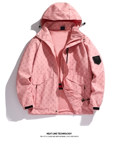 Detail of pink hooded windbreaker jacket with all-over logo print and sleeve sport badge