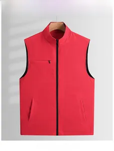 Detail view of red outdoor vest with standing collar and zipper pockets