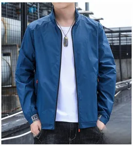 Detail view of men's blue sun protection jacket featuring a high collar and zipper closure