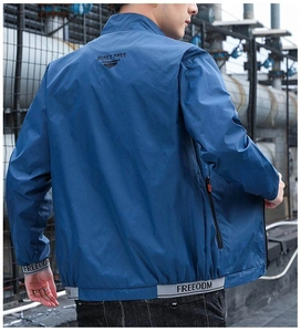 Detailed back view of blue sun-protective jacket showing elastic cuffs and collar text