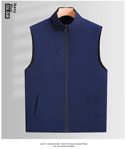 Detail view of navy blue vest showing stand collar and functional zipper pockets
