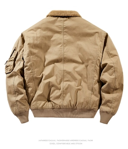 Detail of khaki bomber jacket featuring warm faux shearling collar and utility sleeve pocket