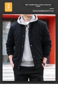 Detail of men's black waffle jacket with button closure and integrated grey hood lining