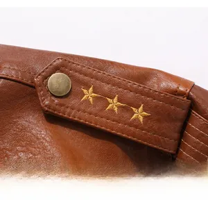 Detailed view of the brown PU leather jacket shoulder with gold star embroidery