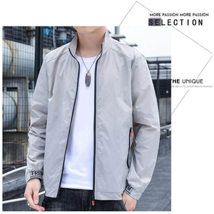 Detail of light gray men's sun protection jacket sleeve featuring FREE lettering text
