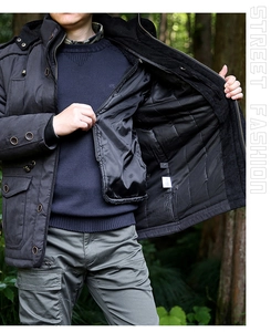 Detail view of men's winter jacket with fleece lining and tactical cargo pockets
