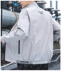 Close-up of lightweight jacket featuring BUILT FREE back print and elastic FREEODM hem