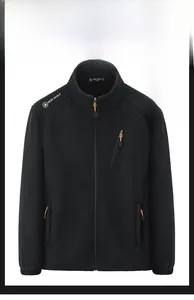 Detail of black fleece jacket showing inner lining and white Free Spirit embroidery