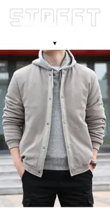 Close-up of khaki waffle texture fabric on men's stand collar jacket with ribbed cuffs