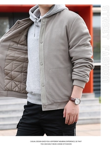 Detail of light gray waffle jacket featuring quilted lining and metal snap buttons