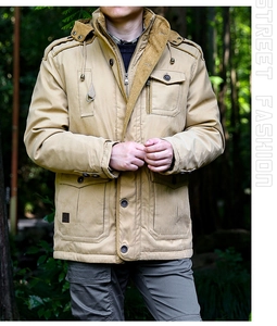Close-up of khaki outdoor hooded jacket featuring corduroy lined collar and multi-pocket design