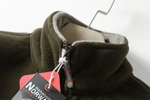Detail of army green fleece jacket featuring warm grey plush lining and zipper collar