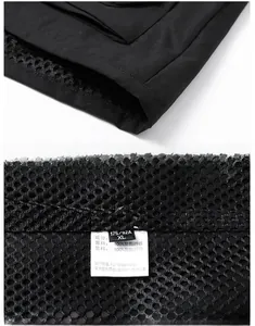 Detail of black vest showing mesh lining and 100% polyester material label