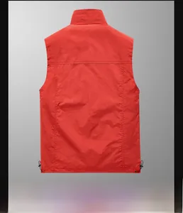 Rear view of red outdoor utility vest featuring adjustable drawstring hem and stand collar