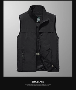Detail view of black utility vest with zip pockets and breathable mesh lining