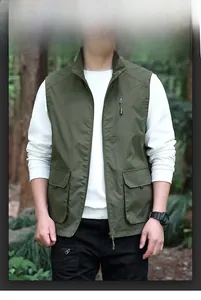 Close-up of military green outdoor utility vest with functional large flap pockets