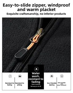 Detail of outdoor fleece jacket zipper with orange puller and durable fabric texture