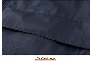 Close-up detail of dark blue outdoor utility vest fabric and chest logo stitching