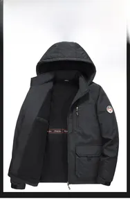 Detail view of men's windproof jacket featuring warm polar fleece lining and hood