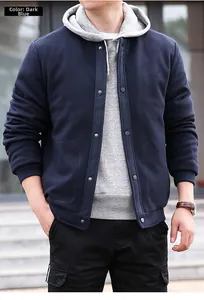 Detail of dark blue waffle knit men's jacket with gray hoodie and snap buttons