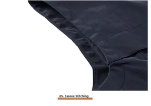 Close-up of precise stitching on the armhole of a navy blue utility photographer vest