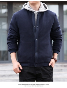 Detail of navy waffle jacket featuring metal snap buttons and gray hooded layer