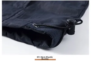 Close-up of the adjustable elastic drawstring hem with plastic cord locks on the utility vest
