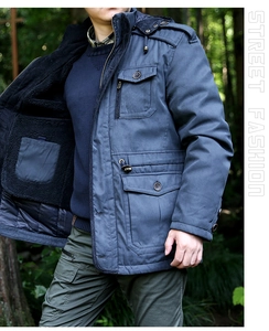 Detail of navy winter parka showing thick black sherpa lining and vintage button pockets