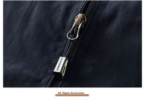 Close-up of industrial zipper with metallic puller and neon green accent on black fabric