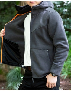 Detail view of grey fleece jacket with orange interior trim and large inner pocket