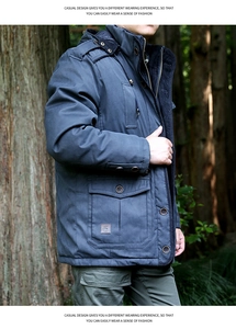 Detail of navy blue winter parka featuring multiple pockets and high-quality windproof fabric