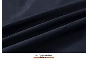 Detail of the high-quality dark blue fabric with smooth texture and comfortable drape