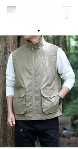 Detail of khaki outdoor vest showing symmetrical flap pockets and chest zipper pocket