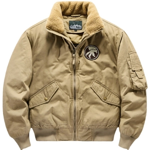Men's khaki bomber jacket with faux fur collar and embroidered badge on white background