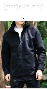 Close-up of black men's hooded fleece jacket with zipper pockets in outdoor setting