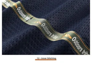 Detail of breathable navy mesh lining and branded green webbing on outdoor vest