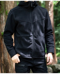 Close-up of black men's hooded fleece jacket with full zipper and outdoor hiking style