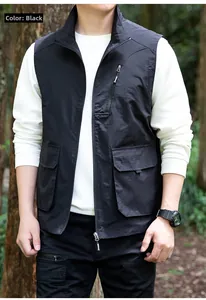 Detail of black utility vest with multi-pocket design and standing collar for outdoors