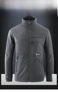 Detail of the reversible fleece jacket showing the high collar and grey windproof fabric