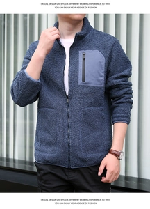 Close-up of navy polar fleece jacket featuring stand collar and grey zipped chest pocket